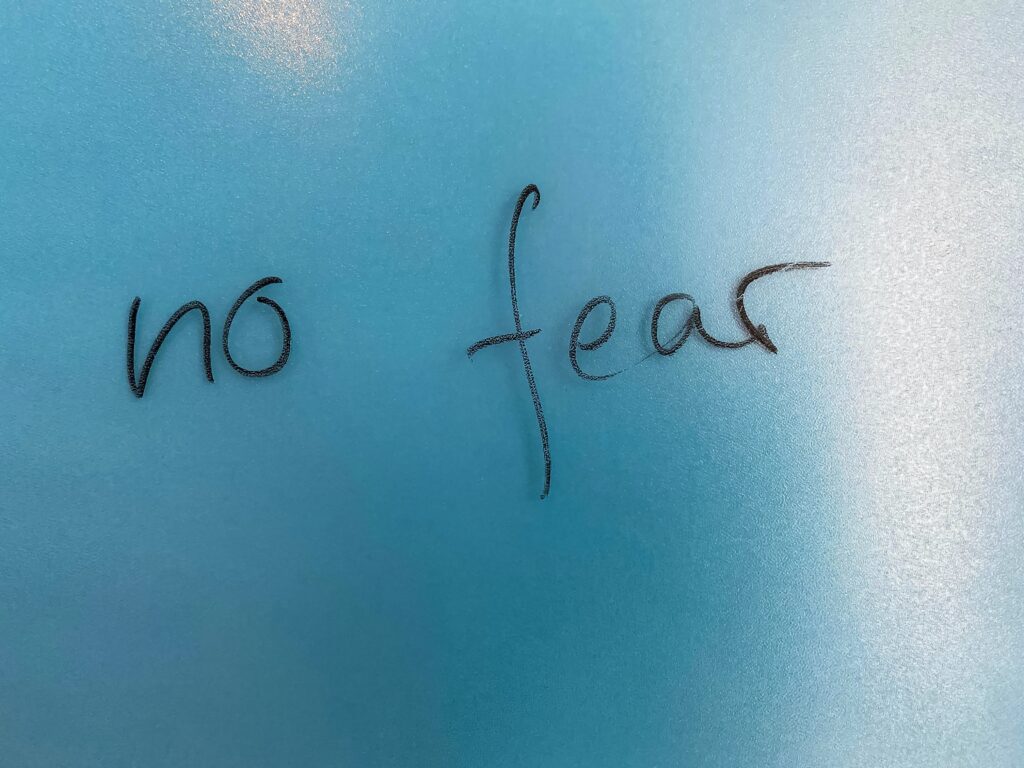 The words "no fear" on a blue background
