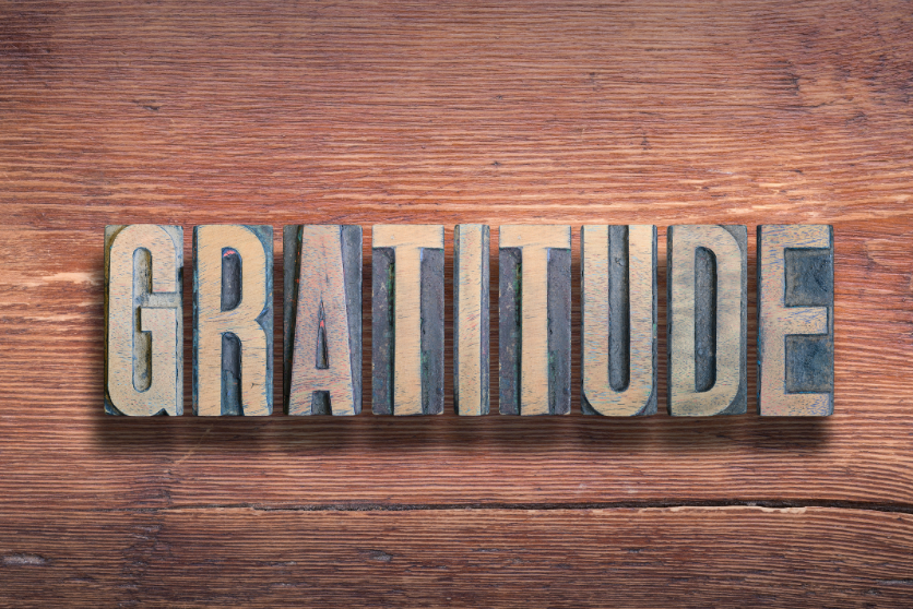 The word Gratitude in wood